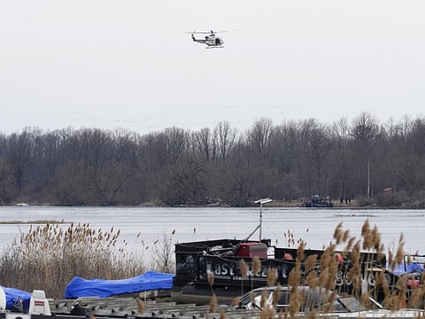 A helicopter searches an area in Akwesasne, Quebec, Friday, March 31, 2023. Authorities in the Mohawk Territory of Akwesasne. (Photo | AP)
