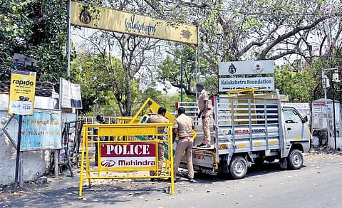 Police personnel removing barricades outside Kalakshetra Foundation on Saturday as situation started limping back to normal after days. (Photo| Martin Louis, EPS)