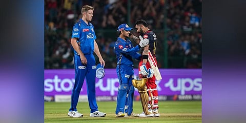 RCB batter Virat Kohli congratulates by MI players after winning over MI during the IPL 2023 match between RCB and MI. (Photo | PTI)