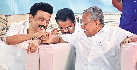 Chief Minister Pinarayi Vijayan having a word with his Tamil Nadu counterpart M K Stalin during the centenary celebrations of Vaikom Satyagraha in Kottayam on Saturday | Express