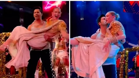 Bollywood actor Varun Dhawan carries and kisses Gig Hadid during a performance at the Nita Mukesh Ambani Cultural Centre's inauguration in Mumbai on April 1, 2023.