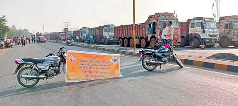 (Far top) Vehicles stranded on state highway-10 near Sundargarh town and women walk with their bags in Nuapada during the bandh | Express