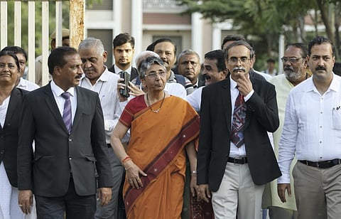 Ex-MLA Maya Kodnani along with advocates comes out of the Sessions Court after the verdict on Naroda Gam massacre case, in Ahmedabad, on April 20, 2023. (Photo | PTI)