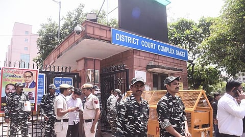 Heavy security and media presence outside Saket court in New Delhi.