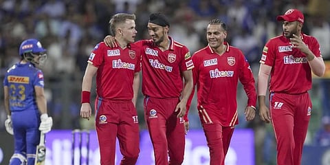 Arshdeep Singh and Sam Curran (L) celebrate the wicket Ishan Kishan during the IPL match between PBKS and MI at Wankhede Stadium in Mumbai, April 22, 2023. (Photo | PTI)