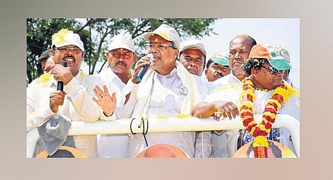 Congress leader Siddaramaiah along with his son Dr Yathindra and others campaign in Varuna constituency in Mysuru district on Saturday. (Photo | Express)