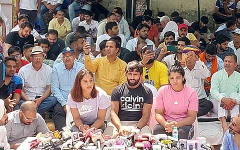 Wrestlers Bajrang Punia, Vinesh Phogat, Sakshi Malik addresses the media during a protest against WFI President Brij Bhushan Sharan singh at Jantar Mantar in New Delhi. (Photo | Shekhar Yadav, EPS)