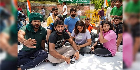 Wrestlers Bajrang Punia, Vinesh Phogat, Sakshi Malik and others during their protest at Jantar Mantar, in New Delhi, Monday, April 24, 2023. (Photo | PTI)