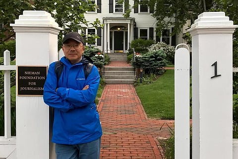 In this photo provided by the Dong family, Dong Yuyu stands at the gates of the Nieman Foundation for Journalism at Harvard University in Cambridge, Mass in May 2017. (Photo | Dong Family via AP)