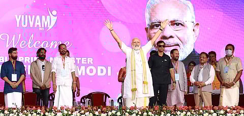 Prime Minister Narendra Modi waving at the crowd during Yuvam 2023 conclave at SH College in Thevara, Kochi. (Photo | T P Sooraj, EPS)