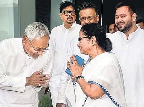  Mamata Banerjee greets Nitish Kumar in Howrah district on Monday as Tejashwi Yadav looks on | PTI 