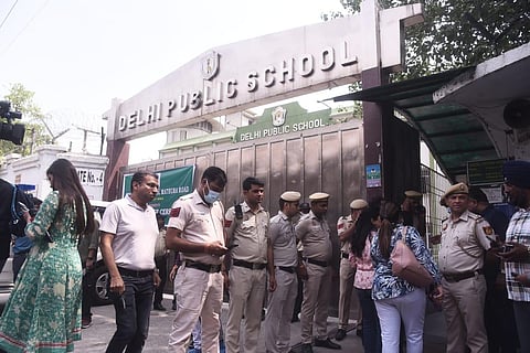 Parents gather outside Delhi Public School after school authorities received a bomb threat via an e-mail. (Photo | EPS/ Parveen Negi)
