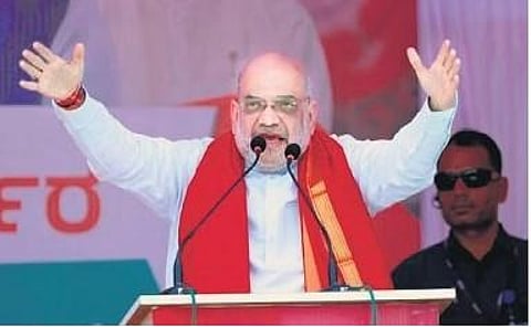 Home Minister Amit Shah addresses a rally at Banahatti on Tuesday