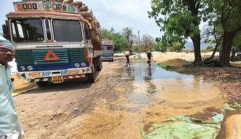 Paddy stalks strewn for drying, lie damaged at a paddy purchase center in Srikonda mandal of Nizamabad district on Tuesday