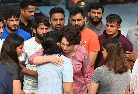 Congress leader Priyanka Gandhi embraces Sakshi Malik during her visit to meet the protesting Wrestlers at Jantar Mantar in New Delhi on Saturday. (Photo | Shekhar yadav, EPS)