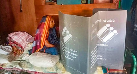 An elderly voter casts her vote for the Karnataka Assembly elections, on Saturday, April 29, 2023.(Photo | PTI)