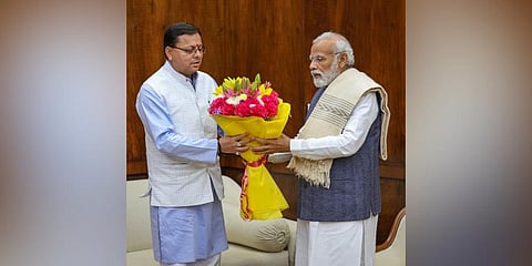 Prime Minister Narendra Modi with Uttarakhand Chief Minister Pushkar Singh Dhami during a meeting, in New Delhi. (Photo | PTI)