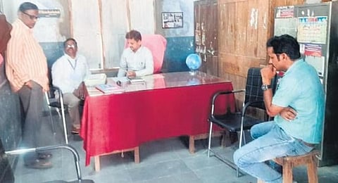 Invigilator Bandappay, right, who shared the Class 10 exam paper on WhatsApp