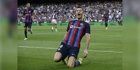 In this August 2022 image, Barcelona's Robert Lewandowski celebrates after scoring his side's opening goal during a Spanish La Liga soccer match against Valladolid CF at the Camp Nou. (Photo | AP)