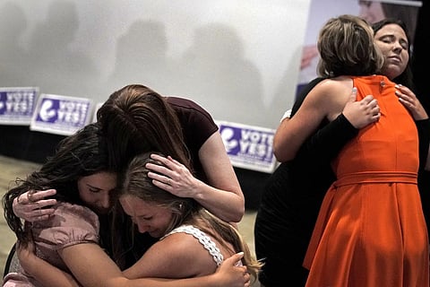 People hug during a 'Value Them Both' watch party after a question involving a constitutional amendment removing abortion protections from the Kansas constitution failed. (Filr Photo |AP)