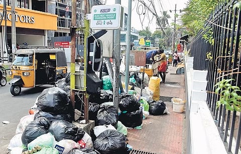 Bags of waste dumped near KSEB’s electric vehicle charging point towards Karukappilly | A Sanesh