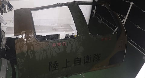 Search and rescue operation continued Friday and officials said they found a door and other fragments believed to be of the Japanese army helicopter. (Photo | AP)