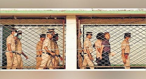 Police personnel take Shahrukh Saifi, the accused in the Elathur train attack case, to the special ward of the Kozhikode Government Medical College Hospital. (Photo| Express)