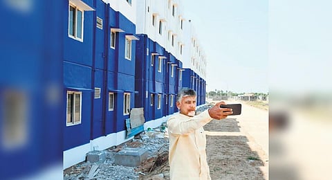 TDP chief N Chandrababu Naidu takes a selfie at TIDCO houses at Venkateswara-puram in Nellore city on Friday | Express
