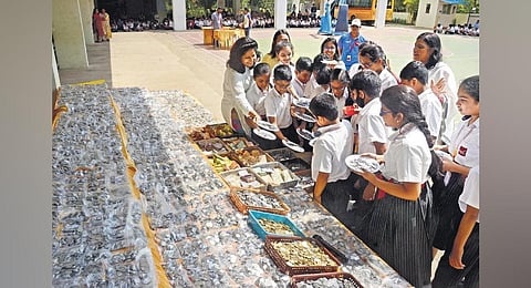 Students of Silver Oaks school donating money for a noble casuse I G Satyanarayana