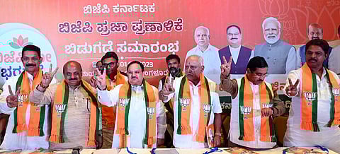BJP National President JP Nadda with Karnataka CM Basavaraj Bommai releases the party's manifesto for the upcoming assembly elections, in Bengaluru, May 1, 2023. (Photo | Nagaraja Gadekal)