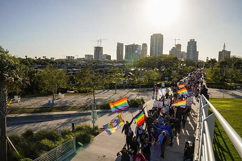 FILE - People march toward the St. Pete Pier on March 12, 2022, during a protest against the controversial 'Don't Say Gay' bill passed by Florida's Republican-led legislature. (Photo | AP)