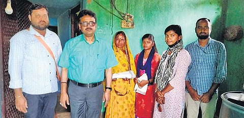 Chhaya Kumari (3rd from right) with her familyand BDO Sunil Kumar Sinha | express