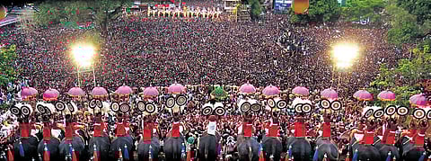 Thousands gathered to witness kudamattom as part of Thrissur Pooram at Thekkinkadu maidan on Sunday | T P Sooraj