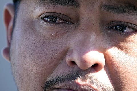 Mass shooting survivor Wilson Garcia sheds a tear as he talks about his wife and son, who were killed in Friday's shooting, April 30, 2023, at a vigil for his son in Cleveland, Texas. (Photo | AP)