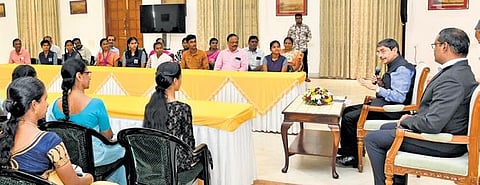 Governor RN Ravi talking to Class 12 board exam toppers at Raj Bhavan on Wednesday | Express