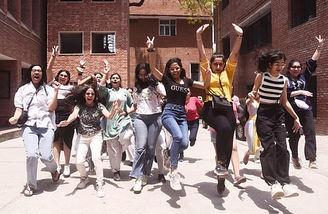 Class 12 students celebrate after the CBSE results are released. (EPS | Parveen Negi)