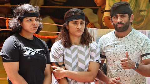 Wrestlers Sakshi Malik, Vinesh Phogat and Bajrang Punia during their protest against Wrestling Federation of India (WFI) chief Brij Bhushan Sharan Singh, in New Delhi.