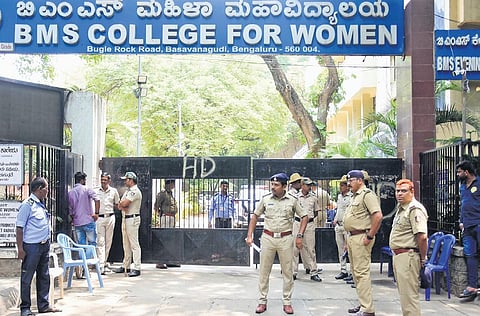Police personnel outside a strong room at BMS College for Women in Basavanagudi in Bengaluru on Thursday. The city has five strongrooms, each under the supervision of an Assistant Commissioner of Poli