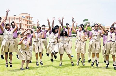 Students of BJEM School celebrating their success in CBSE Class XII exam in Bhubaneswar, on Friday