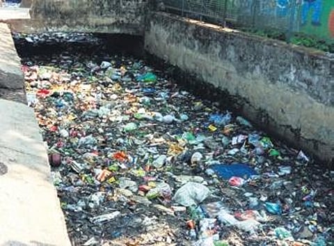 A drain passing through Jhola Sahi choked with silt, garbage and waste material