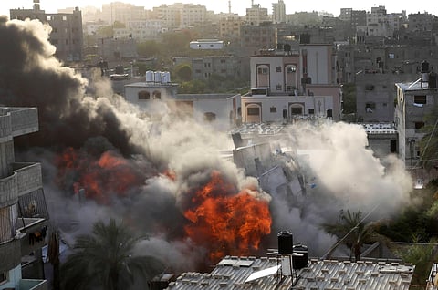 Smoke and fire rise from an explosion caused by an Israeli airstrike targeting a building in Gaza, May 13, 2023. ( Photo | AP )