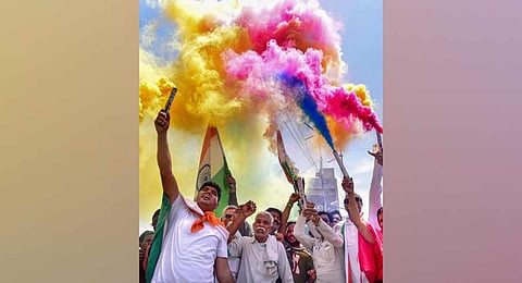 Congress supporters celebrate party's win in the Karnataka Assembly elections. (Photo | PTI)
