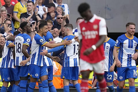 Brighton's players celebrate after scoring their goal during the EPL match between Arsenal and Brighton and Hove Albion at Emirates Stadium in London, Sunday, May 14, 2023. (Photo | AP)