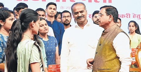 Union Minister for Parliamentary Affairs Pralhad Joshi interacts with the beneficiaries during Rozgar Mela in Bengaluru on Tuesday | Nagaraja Gadekal