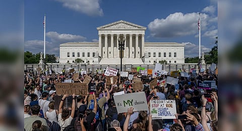 FILE - Abortion-rights and anti-abortion demonstrators gather outside of the Supreme Court in Washington, Friday, June 24, 2022. (Photo | AP)