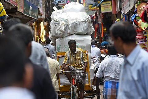 A rickshaw puller taking the load at kasichetty street i during world labour day in Chennai ((Photo | EPS/ P Ravikumar)