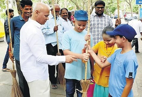 TTD executive officer AV Dharma Reddy taking part in the cleanliness drive, Sundara Tirumala-Suddha Tirumala, along with volunteers at Tirumala I Express