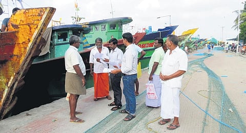 Officials inspecting the fishing boats in Nagapattinam fishing harbour on Friday | Express