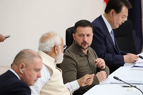 Narendra Modi and Volodymyr Zelenskyy have a talk while attending a session of the Group of Seven nations' meetings in Hiroshima. (Photo | PTI)