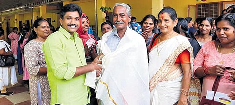 Kerala State Literacy Mission Authority officials felicitating C V Surendran, the oldest aspirant attending the 12th standard equivalency examination at Cherthala Centre on Saturday | Express